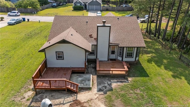 306 Longleaf Pines Dr, Raeford, NC 28376 - back of house featuring a wooden deck and roof with shingles