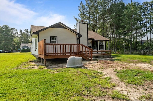 306 Longleaf Pines Dr, Raeford, NC 28376 - rear view of property featuring a wooden deck and a chimney