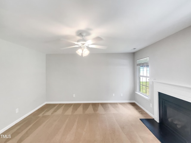 735 Sycamore Springs Dr, Fuquay Varina, NC 27526 - unfurnished living room with baseboards, a ceiling fan, carpet floors, and a glass covered fireplace