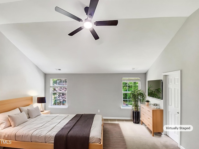 735 Sycamore Springs Dr, Fuquay Varina, NC 27526 - bedroom with lofted ceiling, ceiling fan, light colored carpet, and baseboards