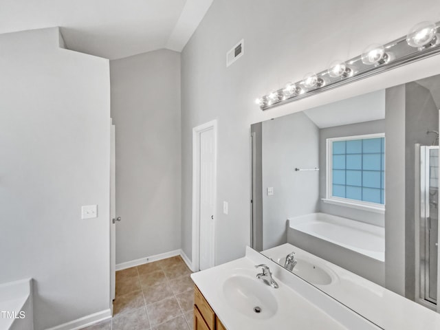735 Sycamore Springs Dr, Fuquay Varina, NC 27526 - bathroom with a garden tub, vanity, a stall shower, tile patterned floors, and baseboards