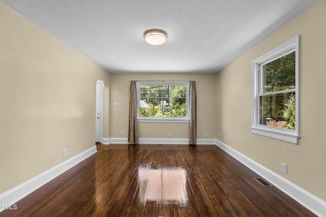 2712 Broad St, Durham, NC 27704 - spare room with hardwood / wood-style floors, baseboards, and arched walkways