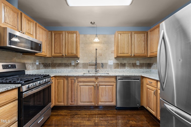 2712 Broad St, Durham, NC 27704 - kitchen with stainless steel appliances, dark wood finished floors, and light stone counters
