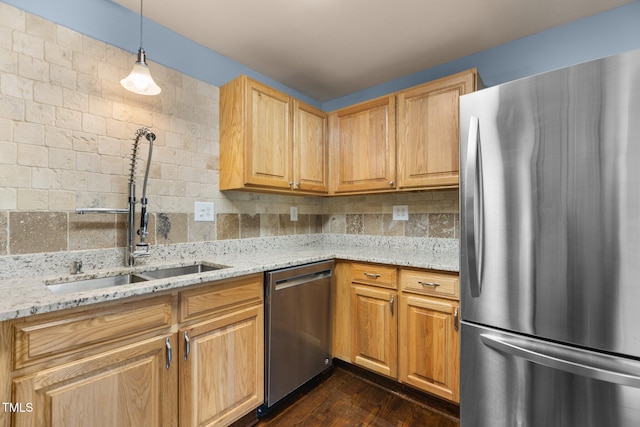 2712 Broad St, Durham, NC 27704 - kitchen featuring stainless steel appliances, a sink, light stone counters, dark wood-style flooring, and backsplash