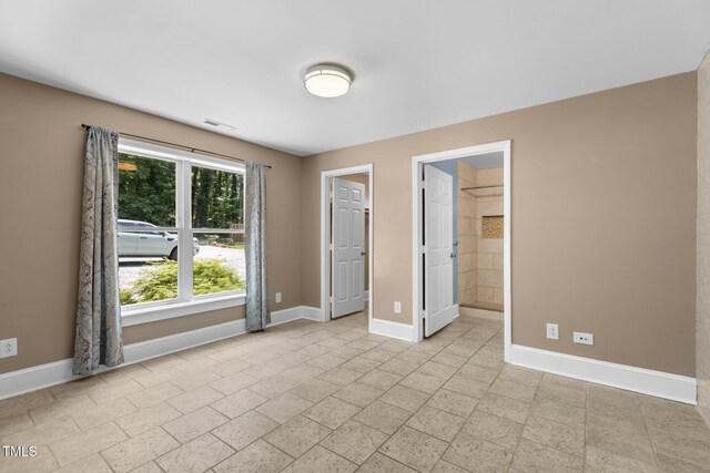 2712 Broad St, Durham, NC 27704 - unfurnished bedroom featuring baseboards
