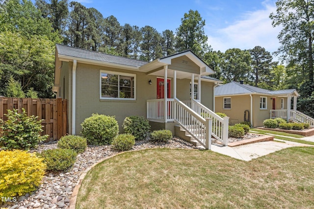 2712 Broad St, Durham, NC 27704 - ranch-style home featuring brick siding and a shingled roof