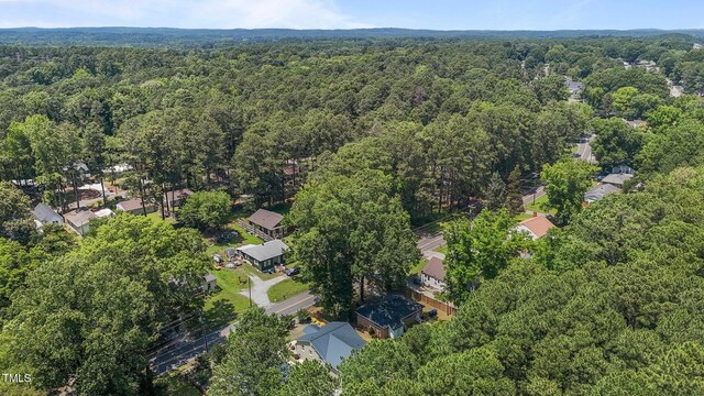 2712 Broad St, Durham, NC 27704 - aerial overview of property's location with a heavily wooded area and nearby suburban area