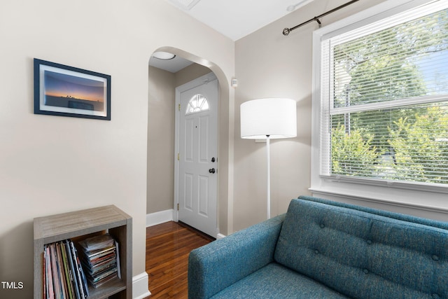 2710 Broad St, Durham, NC 27704 - foyer with arched walkways, healthy amount of natural light, dark wood-type flooring, and baseboards