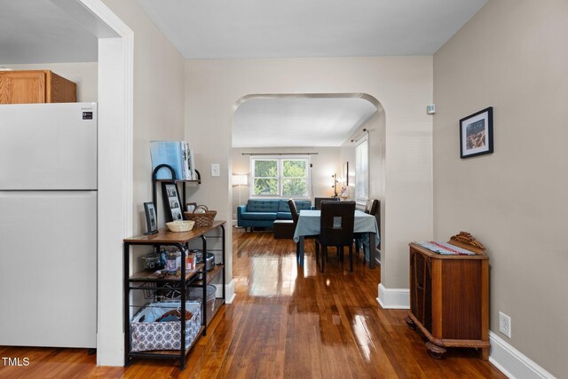 2710 Broad St, Durham, NC 27704 - corridor featuring arched walkways, wood-type flooring, and baseboards