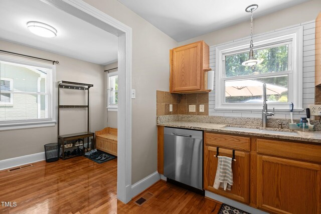 2710 Broad St, Durham, NC 27704 - kitchen with dishwasher, a sink, dark wood-type flooring, and baseboards