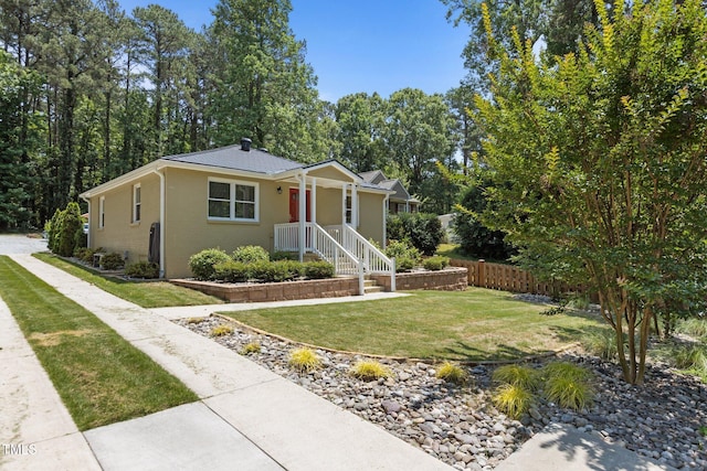 2710 Broad St, Durham, NC 27704 - view of front facade featuring a front yard, metal roof, and brick siding