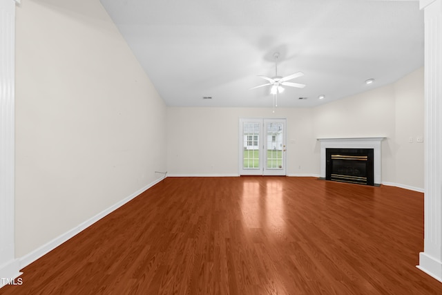 3027 Maple Unit T1, Burlington, NC 27215 - unfurnished living room featuring ceiling fan, wood finished floors, baseboards, and a fireplace with flush hearth