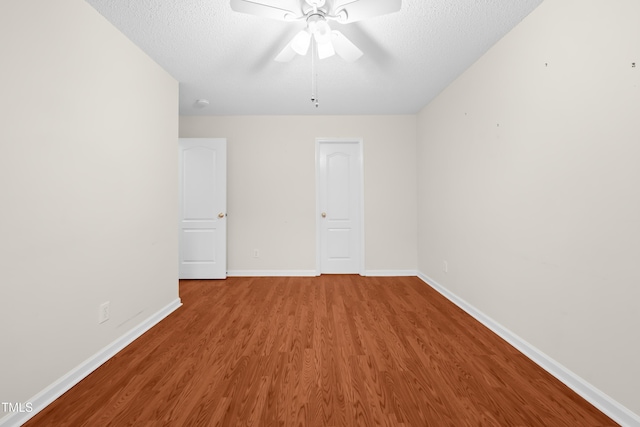 3027 Maple Unit T1, Burlington, NC 27215 - spare room with wood finished floors, ceiling fan, baseboards, and a textured ceiling