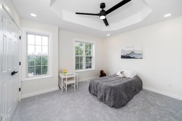 2001 Turtle Point Dr, Raleigh, NC 27604 - carpeted bedroom featuring a tray ceiling, a ceiling fan, recessed lighting, and a closet