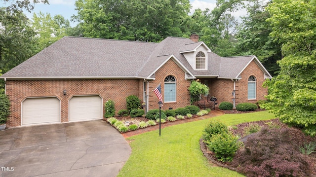 414 Bakewell Ct, Wake Forest, NC 27587 - view of front of house with a garage, brick siding, driveway, and roof with shingles