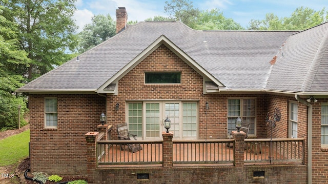 414 Bakewell Ct, Wake Forest, NC 27587 - view of front of house featuring a chimney, brick siding, roof with shingles, and a deck