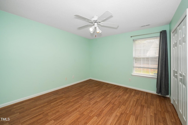 5006 Silhouette Dr, Durham, NC 27713 - empty room featuring wood finished floors, baseboards, and a ceiling fan