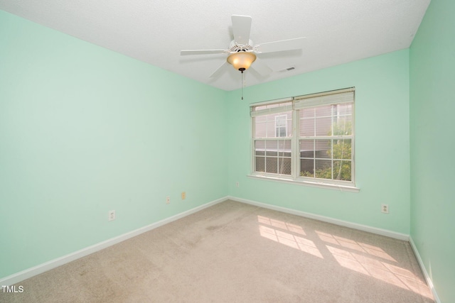 5006 Silhouette Dr, Durham, NC 27713 - carpeted spare room featuring baseboards and ceiling fan