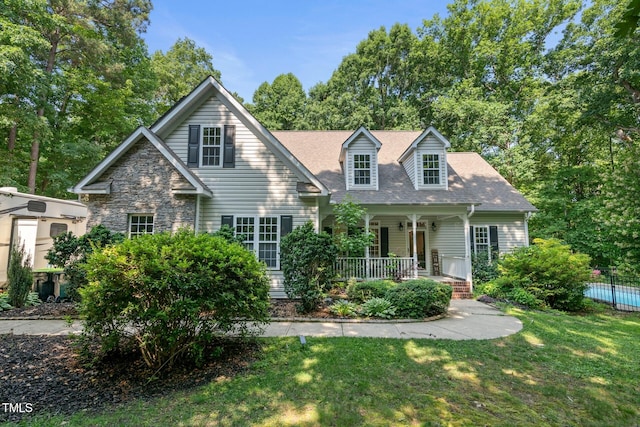 395 Timberlands Dr, Louisburg, NC 27549 - view of front of house featuring a porch and roof with shingles