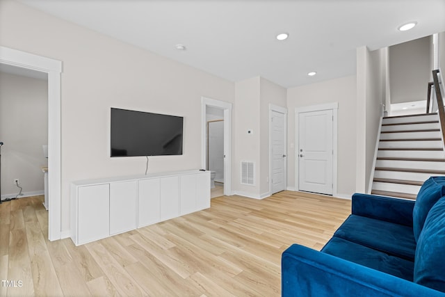 1203 Corkery Ridge Ct, Cary, NC 27519 - living area with wood finished floors, stairway, baseboards, and recessed lighting