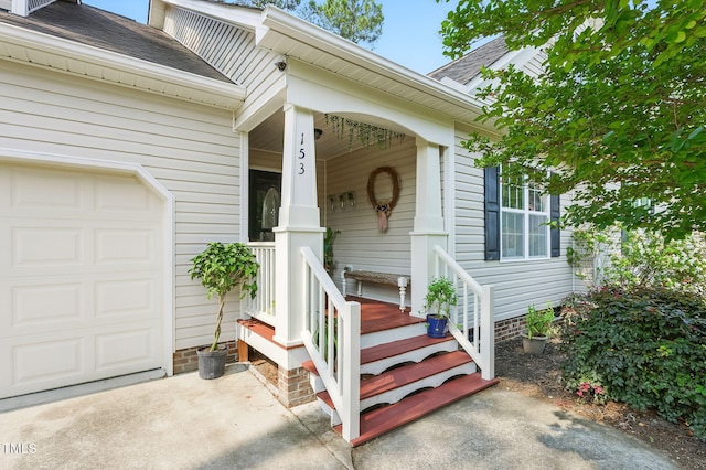 153 Hickory Nut Dr, Smithfield, NC 27577 - property entrance featuring a garage, roof with shingles, and a porch