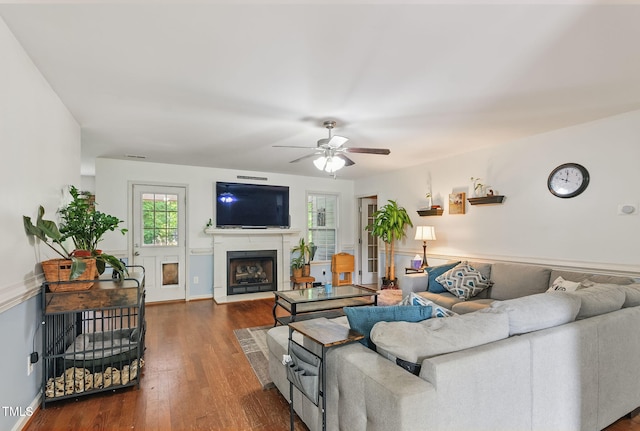 153 Hickory Nut Dr, Smithfield, NC 27577 - living room with a ceiling fan, wood finished floors, a fireplace with flush hearth, and baseboards