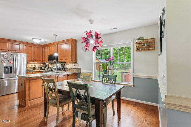 153 Hickory Nut Dr, Smithfield, NC 27577 - dining space featuring light wood-type flooring and baseboards