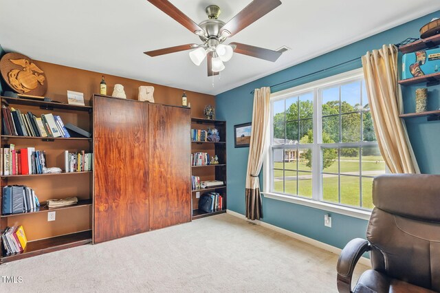 153 Hickory Nut Dr, Smithfield, NC 27577 - living area featuring healthy amount of natural light, a ceiling fan, carpet, and baseboards