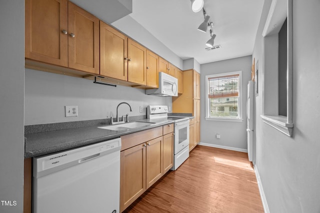 134 Kingsbury Dr, Chapel Hill, NC 27514 - kitchen with white appliances, a sink, baseboards, light wood finished floors, and track lighting