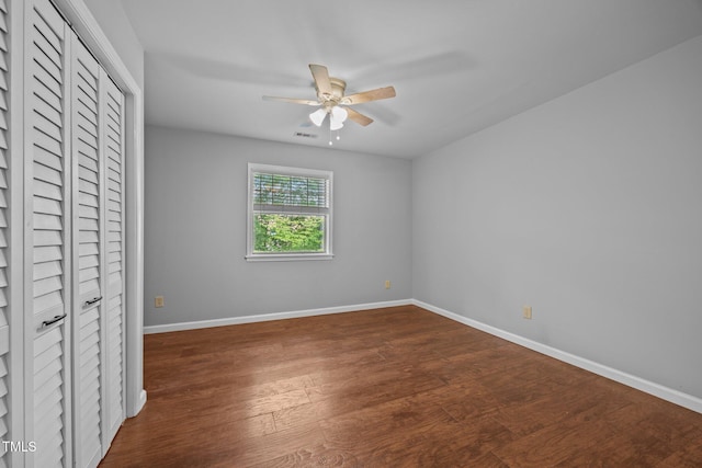 134 Kingsbury Dr, Chapel Hill, NC 27514 - unfurnished bedroom with baseboards, dark wood-style flooring, a closet, and a ceiling fan
