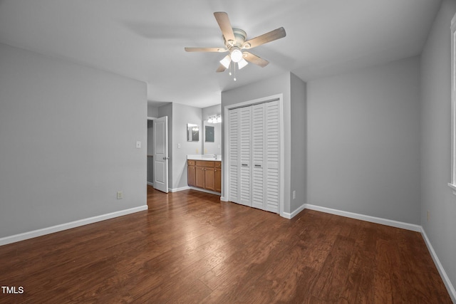 134 Kingsbury Dr, Chapel Hill, NC 27514 - unfurnished bedroom with baseboards, a closet, dark wood-style floors, and a sink
