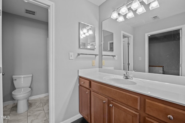 134 Kingsbury Dr, Chapel Hill, NC 27514 - bathroom featuring marble finish floors, vanity, toilet, and baseboards