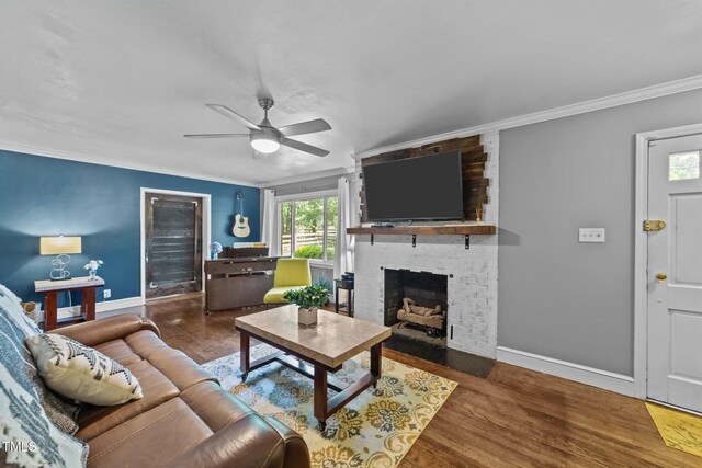 2005 Cole Mill Rd, Durham, NC 27712 - living area with a ceiling fan, crown molding, wood finished floors, baseboards, and a brick fireplace