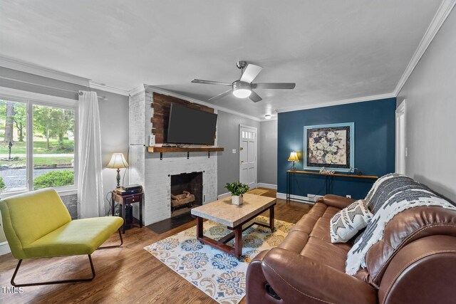 2005 Cole Mill Rd, Durham, NC 27712 - living room with wood finished floors, ornamental molding, a fireplace, a ceiling fan, and baseboards
