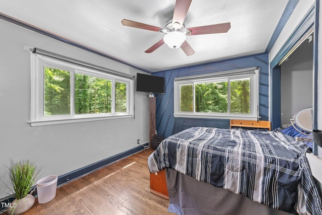 2005 Cole Mill Rd, Durham, NC 27712 - bedroom featuring wood finished floors, baseboards, a ceiling fan, and a closet
