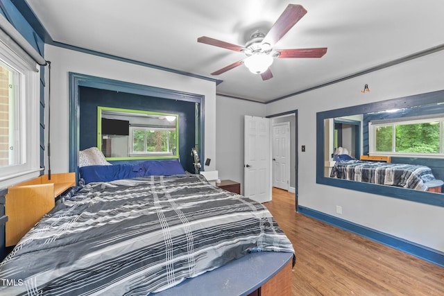 2005 Cole Mill Rd, Durham, NC 27712 - bedroom featuring wood finished floors, ceiling fan, and baseboards