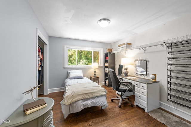 2005 Cole Mill Rd, Durham, NC 27712 - bedroom featuring dark wood-style flooring, a closet, baseboards, and a desk