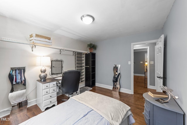 2005 Cole Mill Rd, Durham, NC 27712 - bedroom featuring dark wood-style floors, a desk, and baseboards