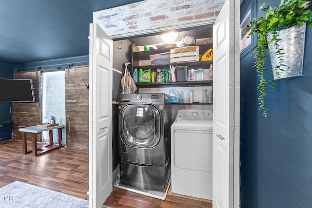 2005 Cole Mill Rd, Durham, NC 27712 - laundry room featuring separate washer and dryer, wood finished floors, and a barn door