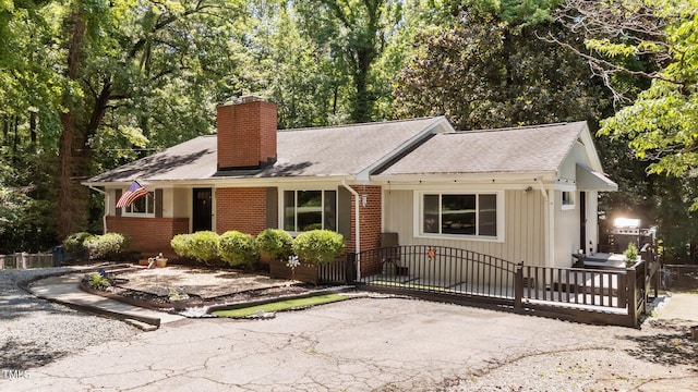 2005 Cole Mill Rd, Durham, NC 27712 - ranch-style home featuring a chimney, brick siding, and roof with shingles