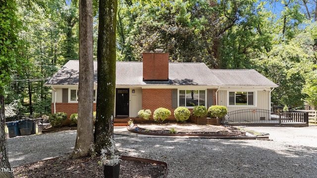 2005 Cole Mill Rd, Durham, NC 27712 - ranch-style house with a chimney, brick siding, and driveway