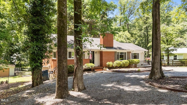 2005 Cole Mill Rd, Durham, NC 27712 - view of front of property featuring brick siding and a chimney