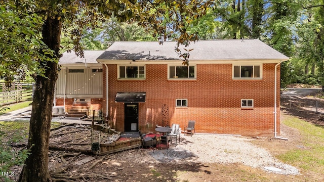 2005 Cole Mill Rd, Durham, NC 27712 - rear view of house with brick siding and roof with shingles