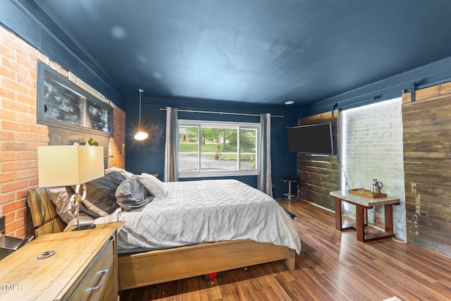 2005 Cole Mill Rd, Durham, NC 27712 - bedroom with wood finished floors and brick wall