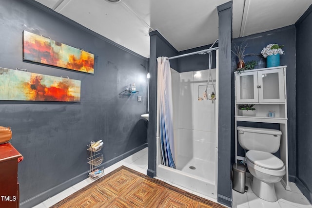 2005 Cole Mill Rd, Durham, NC 27712 - bathroom featuring toilet, a shower stall, tile patterned floors, and baseboards