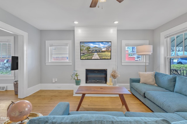602 Dunbar St, Durham, NC 27701 - living area with baseboards, light wood finished floors, a large fireplace, ceiling fan, and recessed lighting
