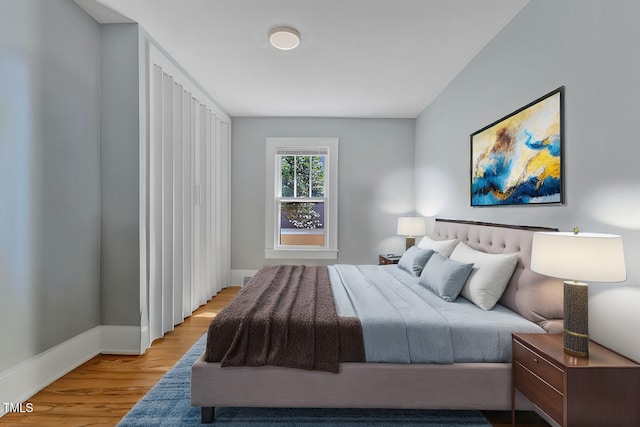 602 Dunbar St, Durham, NC 27701 - bedroom featuring light wood-type flooring and baseboards