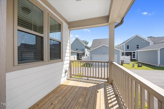 212 Aubey Ln, Wake Forest, NC 27587 - wooden terrace featuring a residential view, an outdoor structure, and a garage