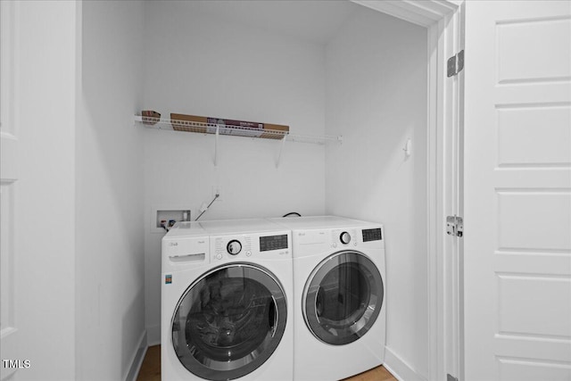 212 Aubey Ln, Wake Forest, NC 27587 - laundry room with washer and dryer and baseboards