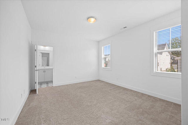 212 Aubey Ln, Wake Forest, NC 27587 - unfurnished room featuring carpet floors, plenty of natural light, and baseboards